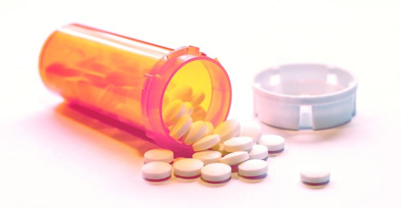 prescription drug bottle on its side