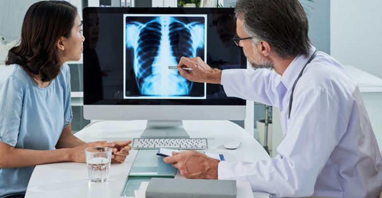 doctor showing patient x-ray