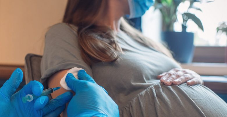 pregnant woman receiving vaccine