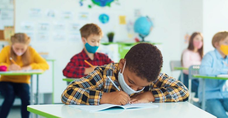 Masked kids in classroom