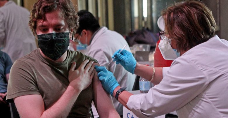 Top FDA official says fully vaccinated Americans may need more Covid shots this fall
