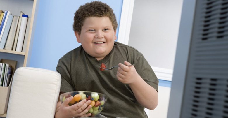Kid eating and smiling