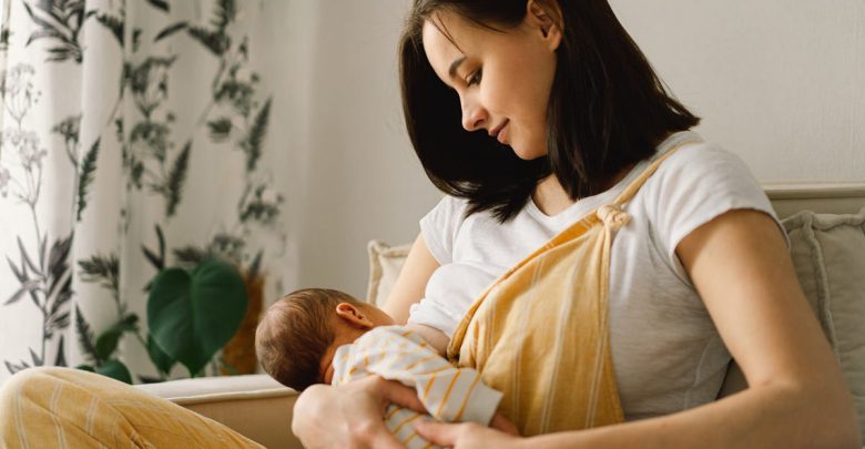 woman breastfeeding her baby