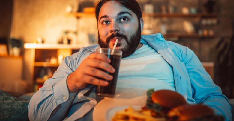 Fat Man Eating Fast Food