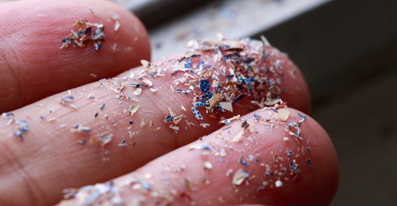 Close up shot of microplastics on someone's hand