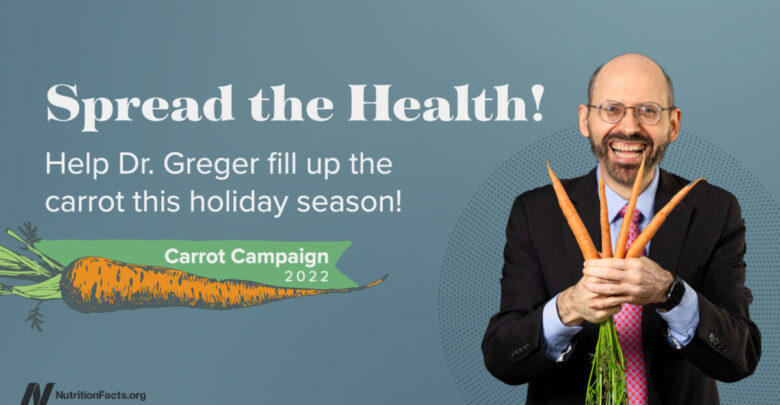 Spread the Health with a photo of Dr. Greger holding carrots