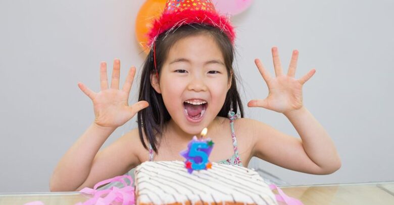 girl and birthday cake