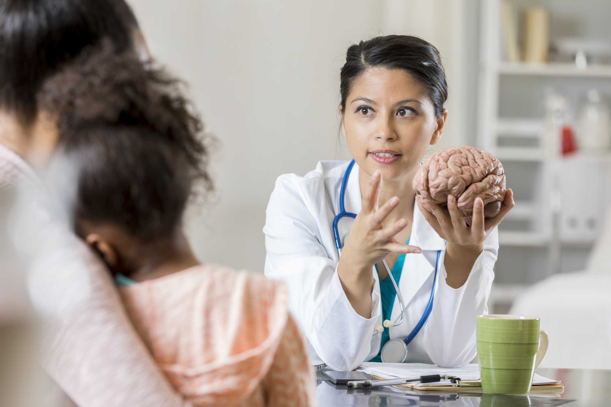 Neurologist and pediatric patient