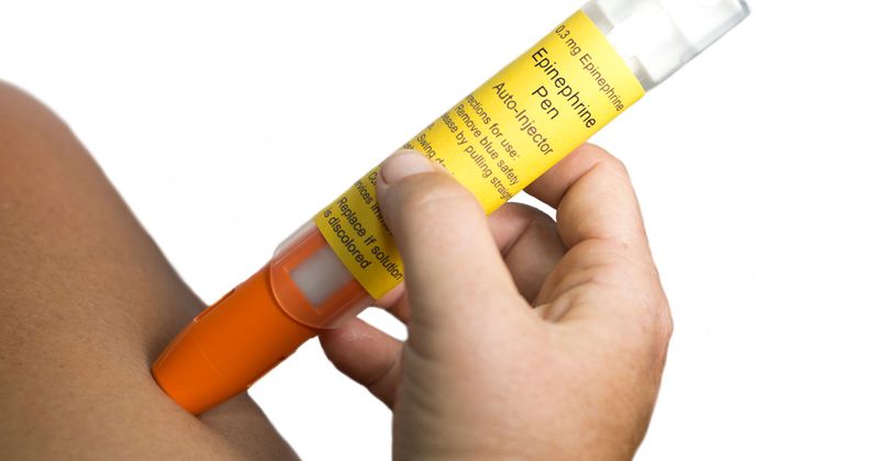Child receiving epinephrine via autoinjector