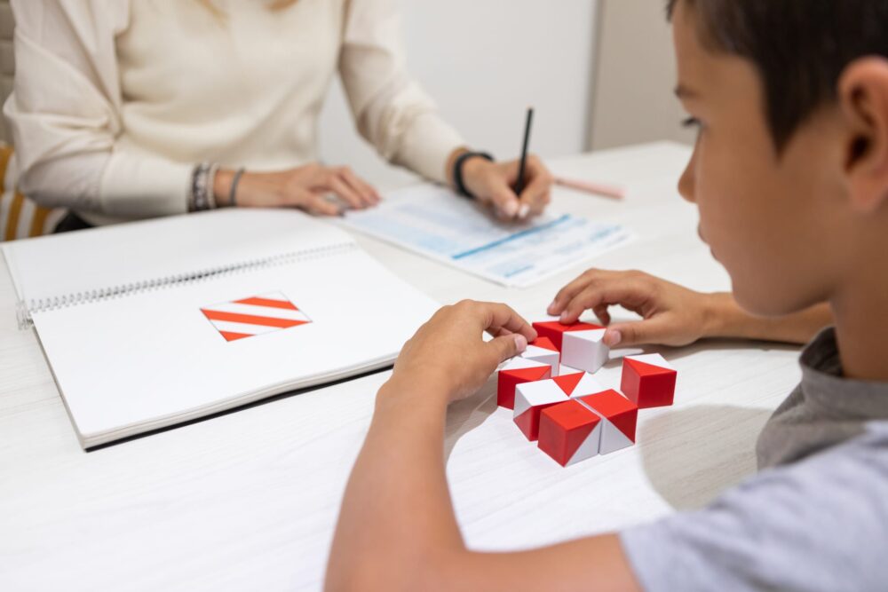 Argentinean-8-years-old-patient-boy-during therapy-consultation- being -evaluated-by-an-education-psychologist